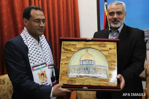 Ismail Haniya, the head of the Hamas government in the Gaza Strip, receives The delegation of the Arab front to participate in the Palestinian resistance in Gaza City on September 6, 2012. Photo by Ahmed Shaat