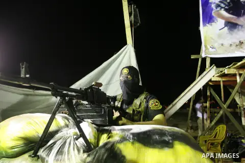 Militants from the Al-Quds Brigades march on patrol in a street in Rafah, southern Gaza strip, on September 6, 2012. An Israeli air strike on the Hamas-governed Gaza Strip killed three gunmen, one of them Al-Geram, as th...