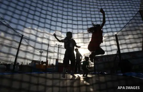 Palestinian children enjoy jump in an amusement Si Lamy park southern Gaza Strip on Sep. 07, 2012. Photo by Majdi Fathi