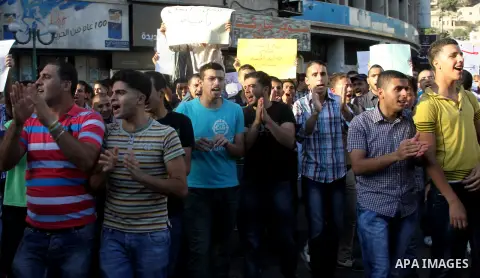 Palestinians protest against rising fuel prices and the high cost of living, in the West Bank city of Nablus, Sept. 8, 2012. Photo by Nedal Eshtayah
