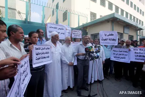 Palestinians take part in a protest against unemployment and the economic situation in the Gaza Strip, in front of the UNRWA headquarters in Gaza city on Sep. 09, 2012. Photo by Ashraf Amra