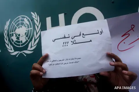 Palestinians take part in a protest against unemployment and the economic situation in the Gaza Strip, in front of the UNRWA headquarters in Gaza city on Sep. 09, 2012. Photo by Ashraf Amra