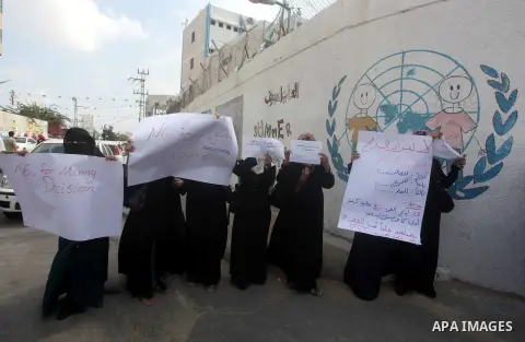 Palestinians take part in a protest against unemployment and the economic situation in the Gaza Strip, in front of the UNRWA headquarters in Gaza city on Sep. 09, 2012. Photo by Ashraf Amra