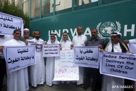 Palestinians take part in a protest against unemployment and the economic situation in the Gaza Strip, in front of the UNRWA headquarters in Gaza city on Sep. 09, 2012. Photo by Ashraf Amra