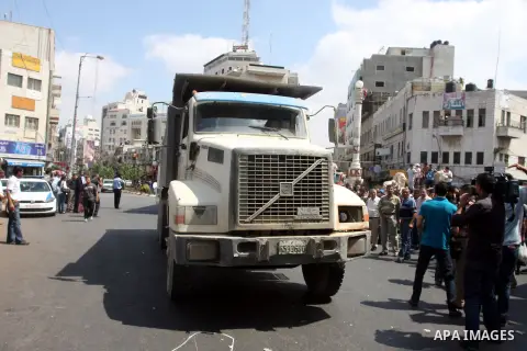 Palestinian truck drivers block a road during a protest against the high cost of living in the West Bank city of Ramallah, Sunday, Sep. 09, 2012. Photo by Issam Rimawi