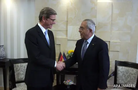 Palestinian Prime Minister Salam Fayyad (R) shakes hands with Germany's Foreign Minister Guido Westerwelle during their meeting in the West Bank city of Ramallah September 9, 2012. Westerwelle urged Iran on Sunday to bri...