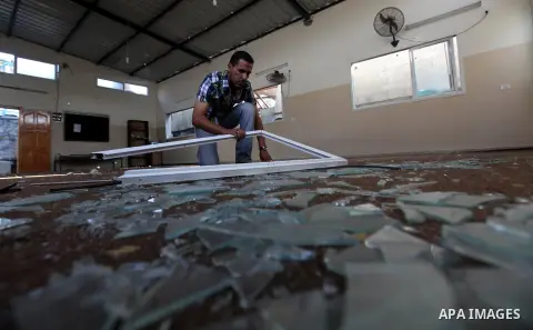 Palestinians inspect the damage at Mosque in Qassam training camp following an Israeli airstrike in Gaza City, early Tuesday, Sep. 10, 2012. Palestinian militants fired rockets towards Israel on Sunday. Photo by Majdi Fa...