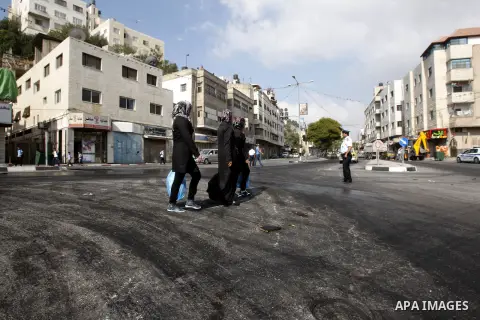 Palestinian students walk on foot at the streets a protest against rising fuel prices and the high cost of living, in the West Bank city of Nablus, on Sept. 10, 2012. Photo by Nedal Eshtayah