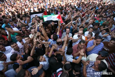 Palestinians chant slogans against Palestinian Prime Minister Salam Fayyad during a protest against the high cost of living in the West Bank city of Hebron, Monday, Sept. 10, 2012. Palestinian demonstrators fed up with h...