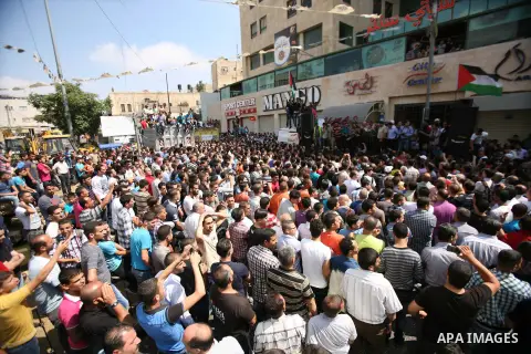 Palestinians chant slogans against Palestinian Prime Minister Salam Fayyad during a protest against the high cost of living in the West Bank city of Hebron, Monday, Sept. 10, 2012. Palestinian demonstrators fed up with h...