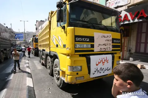 Palestinians chant slogans against Palestinian Prime Minister Salam Fayyad during a protest against the high cost of living in the West Bank city of Hebron, Monday, Sept. 10, 2012. Palestinian demonstrators fed up with h...