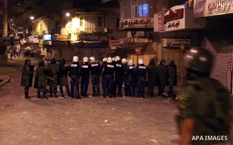 Palestinian security forces disperse crowds during clashes at a demonstration against high living costs and the government in the West Bank city of Nablus September 10, 2012. The Palestinian Authority, which governs Pale...