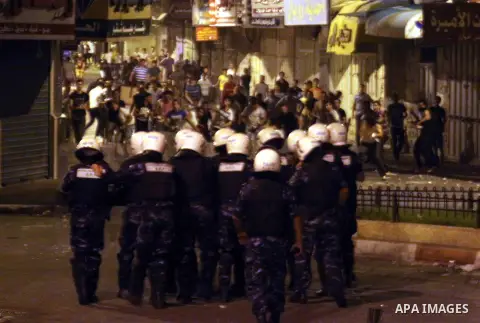 Palestinian security forces disperse crowds during clashes at a demonstration against high living costs and the government in the West Bank city of Nablus September 10, 2012. The Palestinian Authority, which governs Pale...