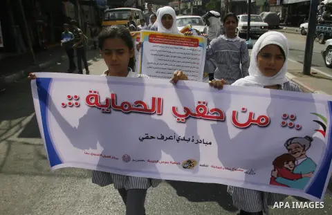 Palestinian students participate in a rally during a campaign to defend their rights in Rafah, in the southern Gaza Strip, Sep. 11, 2012. Photo by Eyad Al Baba