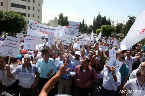 Palestinian protesters shout slogans during a demonstration against the high cost of living in the West Bank city of Ramallah, Sept. 11, 2012. The prime minister pledged on Tuesday that the Palestinian Authority will dec...