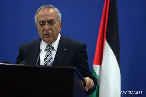 Palestinian Prime Minister Salam Fayyad addresses the media during a news conference in the West Bank city of Ramallah September 11, 2012. Demonstrations against the rising cost of living turned violent in the cities of...