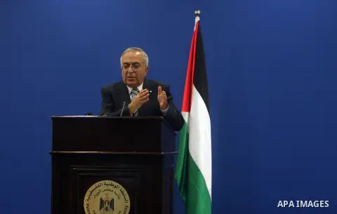 Palestinian Prime Minister Salam Fayyad addresses the media during a news conference in the West Bank city of Ramallah September 11, 2012. Demonstrations against the rising cost of living turned violent in the cities of...