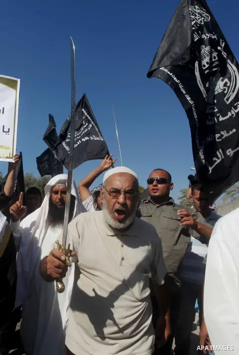 Palestinians hold swords and knifes during protest in front of the United Nations headquarters in Gaza city against the showing of a movie that is allegedly offensive to Muslim Prophet Mohammad, Sept 12, 2012. Photo by A...