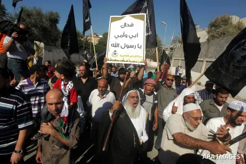 Palestinians chant during protest in front of the United Nations headquarters in Gaza city against the showing of a movie that is allegedly offensive to Muslim Prophet Mohammad, Sept 12, 2012. Photo by Ashraf Amra
