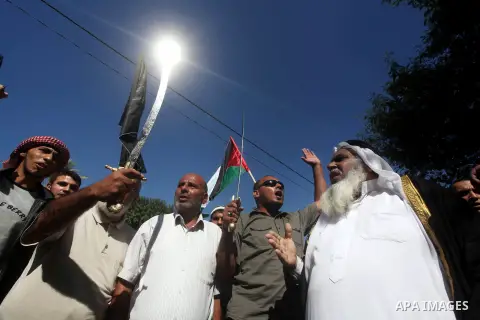 Palestinians hold swords and knifes during protest in front of the United Nations headquarters in Gaza city against the showing of a movie that is allegedly offensive to Muslim Prophet Mohammad, Sept 12, 2012. Photo by A...