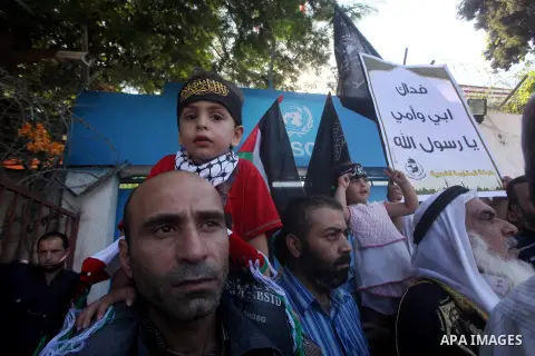Palestinians chant during protest in front of the United Nations headquarters in Gaza city against the showing of a movie that is allegedly offensive to Muslim Prophet Mohammad, Sept 12, 2012. Photo by Ashraf Amra