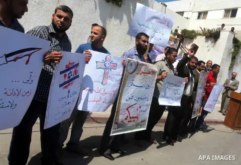 Palestinians protest against the movie, "Innocence of Muslims," in front of the Legislative Council in Gaza City, Sept. 13, 2012. Muslim anger over perceived Western insults to Islam has exploded several times, most rece...