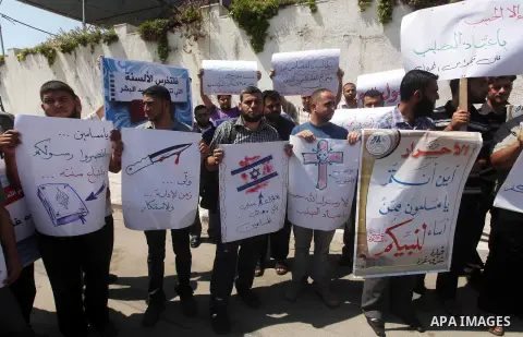 Palestinians protest against the movie, "Innocence of Muslims," in front of the Legislative Council in Gaza City, Sept. 13, 2012. Muslim anger over perceived Western insults to Islam has exploded several times, most rece...