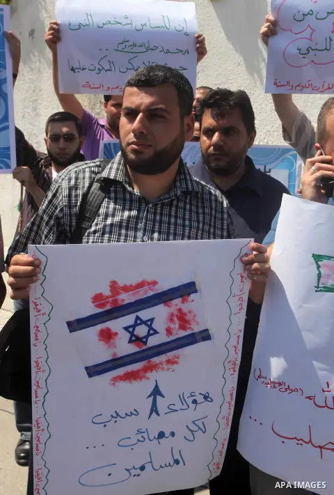 Palestinians protest against the movie, "Innocence of Muslims," in front of the Legislative Council in Gaza City, Sept. 13, 2012. Muslim anger over perceived Western insults to Islam has exploded several times, most rece...