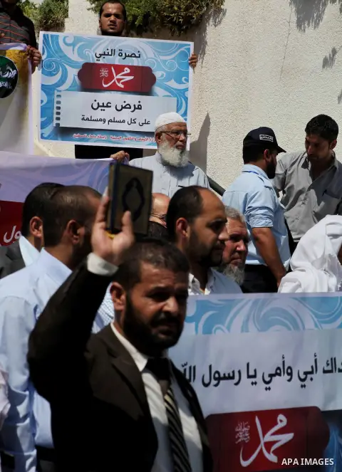 Palestinians protest against the movie, "Innocence of Muslims," in front of the Legislative Council in Gaza City, Sept. 13, 2012. Muslim anger over perceived Western insults to Islam has exploded several times, most rece...