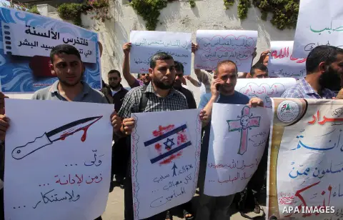 Palestinians protest against the movie, "Innocence of Muslims," in front of the Legislative Council in Gaza City, Sept. 13, 2012. Muslim anger over perceived Western insults to Islam has exploded several times, most rece...
