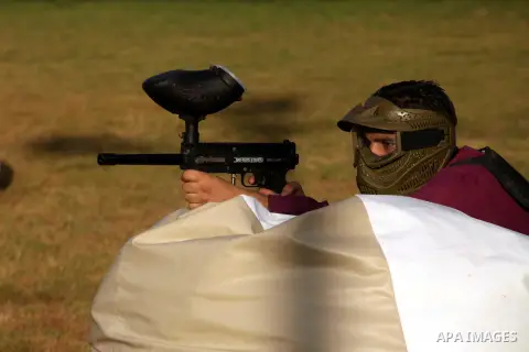 A Palestinian youth plays paintball at Si Lamy park southern Gaza Strip on Sept 13, 2012. Photo by Majdi Fathi
