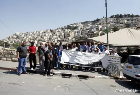 Palestinians protest against the confiscation of Palestinian lands and demolition their houses in the mostly Arab neighbourhood of Silwan in Jerusalem on Sept 13, 2012. Photo by Mahfouz Abu Turk