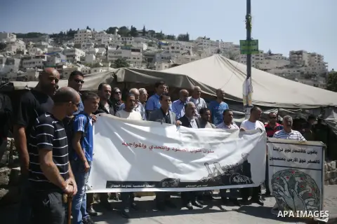 Palestinians protest against the confiscation of Palestinian lands and demolition their houses in the mostly Arab neighbourhood of Silwan in Jerusalem on Sept 13, 2012. Photo by Mahfouz Abu Turk