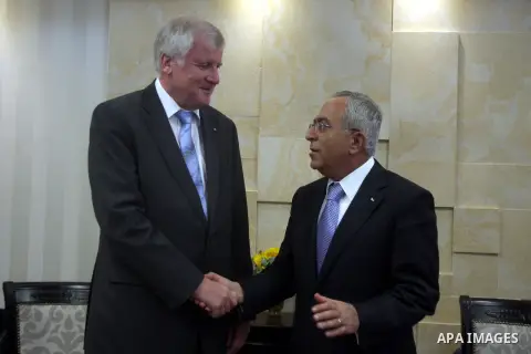 Palestinian Prime Minister Salam Fayyad, right, shakes hands with visiting Bavarian Prime Minister Horst Seehofer during a meeting in the West Bank city of Ramallah, Sept. 11, 2012. Photo by Issam Rimawi