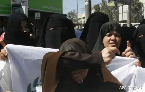 Palestinian women shout anti-US slogans during a demonstration against the controversial film 'Innocence of Muslims' in Rafah southern Gaza strip, on September 14, 2012. The controversial low budget film reportedly made...