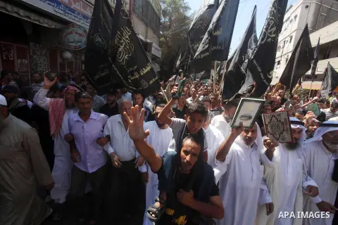 Palestinians hold placards as they shout anti-U.S. slogans during a demonstration against the controversial film 'Innocence of Muslims' in Khan Younis southern Gaza strip, on September 14, 2012. The controversial low bud...