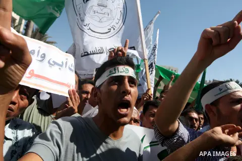 Palestinians shout anti-U.S. slogans during a demonstration against the controversial film 'Innocence of Muslims' in Gaza City, on September 14, 2012. The controversial low budget film reportedly made by an Israeli-Ameri...