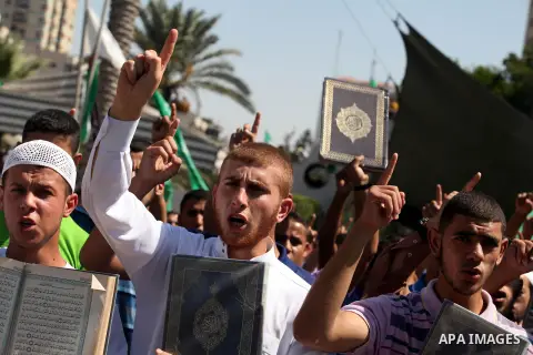 Palestinians shout anti-U.S. slogans during a demonstration against the controversial film 'Innocence of Muslims' in Gaza City, on September 14, 2012. The controversial low budget film reportedly made by an Israeli-Ameri...