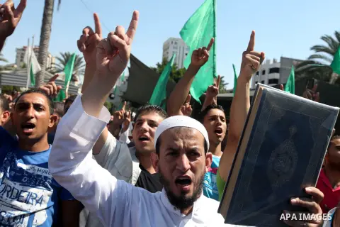 Palestinians shout anti-U.S. slogans during a demonstration against the controversial film 'Innocence of Muslims' in Gaza City, on September 14, 2012. The controversial low budget film reportedly made by an Israeli-Ameri...