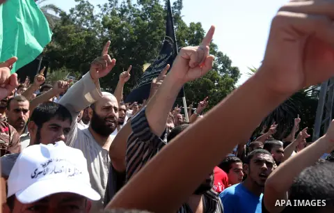 Palestinians shout anti-U.S. slogans during a demonstration against the controversial film 'Innocence of Muslims' in Gaza City, on September 14, 2012. The controversial low budget film reportedly made by an Israeli-Ameri...