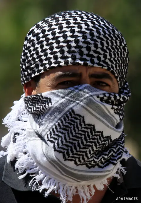 A Palestinian man attends a demonstration against the expropriation of Palestinian land by Israel in the village of Kafr Qaddum, near the West Bank city of Nablus, on Sept. 14, 2012. Photo by Nedal Eshtayah