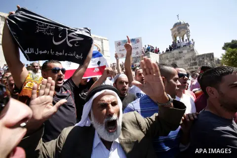 Palestinians shout slogans during a demonstration against the controversial film 'Innocence of Muslims' in front of al-Aqsa Mosqe in Jerusalem, on September 14, 2012. The controversial low budget film reportedly made by...