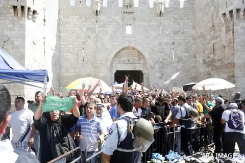 Palestinians shout slogans during a demonstration against the controversial film 'Innocence of Muslims' in front of al-Aqsa Mosqe in Jerusalem, on September 14, 2012. The controversial low budget film reportedly made by...