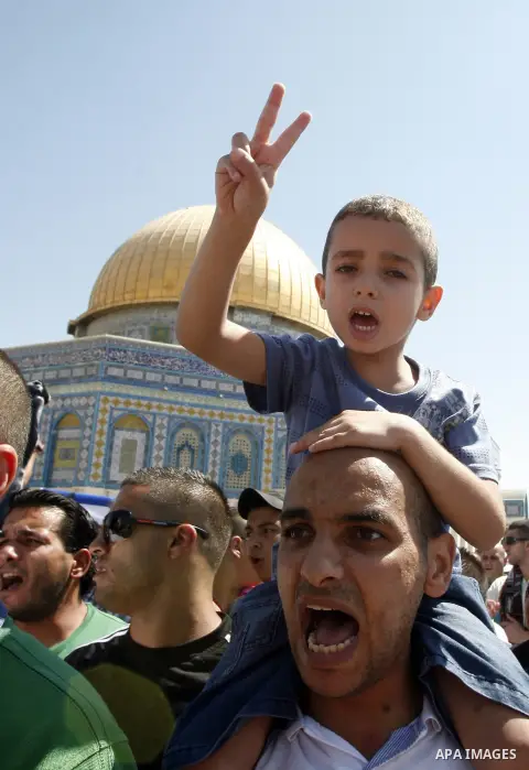 Palestinians shout slogans during a demonstration against the controversial film 'Innocence of Muslims' in front of al-Aqsa Mosqe in Jerusalem, on September 14, 2012. The controversial low budget film reportedly made by...