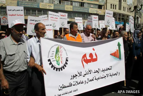 Palestinian protesters shout slogans during a demonstration against the high cost of living in the West Bank city of Nablus, Sept. 15, 2012. The Prime Minister pledged earlier that the Palestinian Authority will decrease...