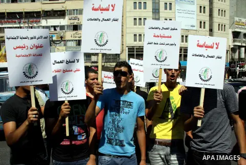 Palestinian protesters shout slogans during a demonstration against the high cost of living in the West Bank city of Nablus, Sept. 15, 2012. The Prime Minister pledged earlier that the Palestinian Authority will decrease...