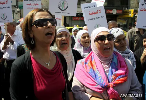 Palestinian protesters shout slogans during a demonstration against the high cost of living in the West Bank city of Nablus, Sept. 15, 2012. The Prime Minister pledged earlier that the Palestinian Authority will decrease...