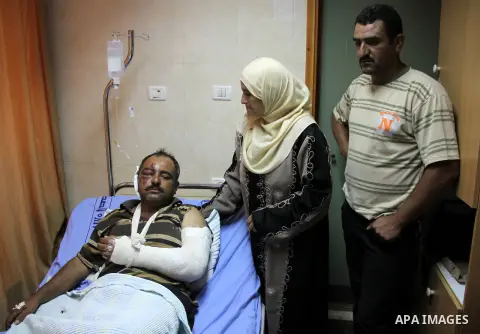 A palestinian Akram Bani Odeh "35" in Rafidia hospital, after he was attacked by Israeli settlers attack Palestinian farmers in the West Bank city of Nablus, on Sep. 16, 2012. Photo by Nedal Eshtayah