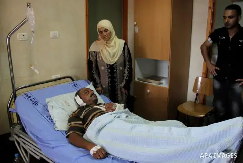A palestinian Akram Bani Odeh "35" in Rafidia hospital, after he was attacked by Israeli settlers attack Palestinian farmers in the West Bank city of Nablus, on Sep. 16, 2012. Photo by Nedal Eshtayah