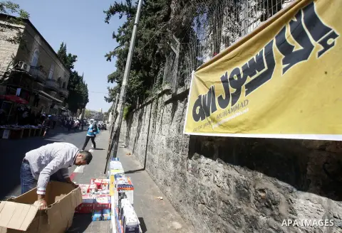A Palestinian man display his goods at the market of Jerusalem's old city on Sept. 16, 2012. Photo by Mahfouz Abu Turk